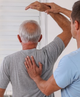 Chiropractor with patient