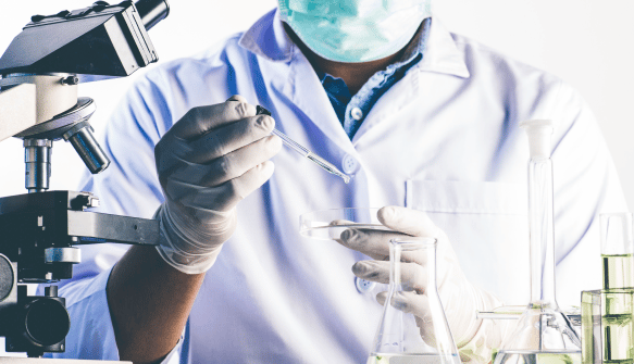 Doctor testing on a Petri dish