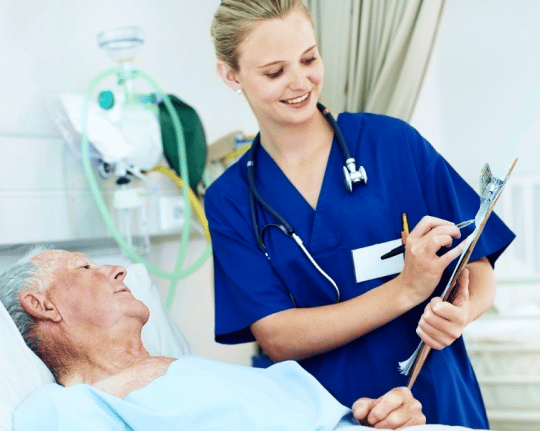 Female doctor reading information from a chart to a patient