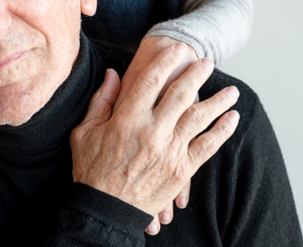 Two people holding hands