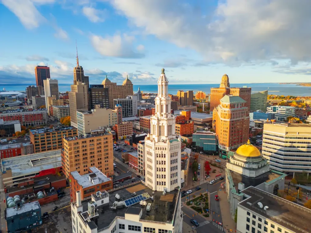 Photo of the city of Buffalo in the state of New York with buildings and a few clouds in the sky