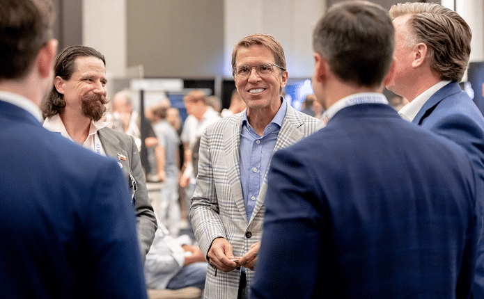Mark Lanier conversing with colleagues at the Lanier Trial Academy.